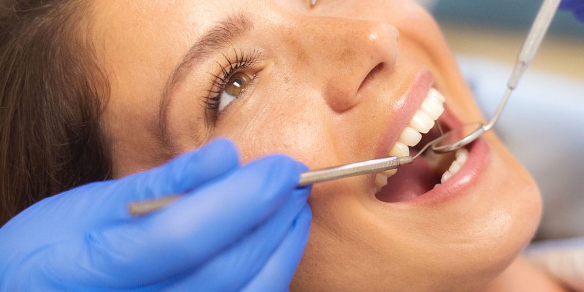 Closeup of Teeth with Dental Mirror